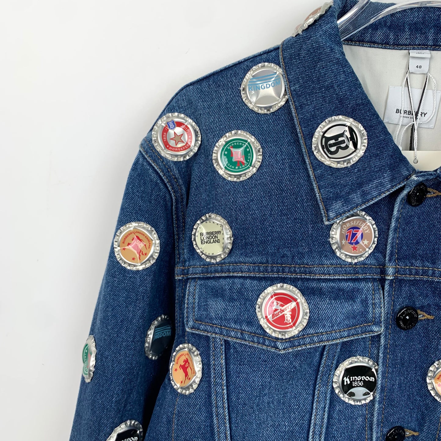 Burberry Blue Denim Jacket with Bottle Cap Embellishments and Collared Design