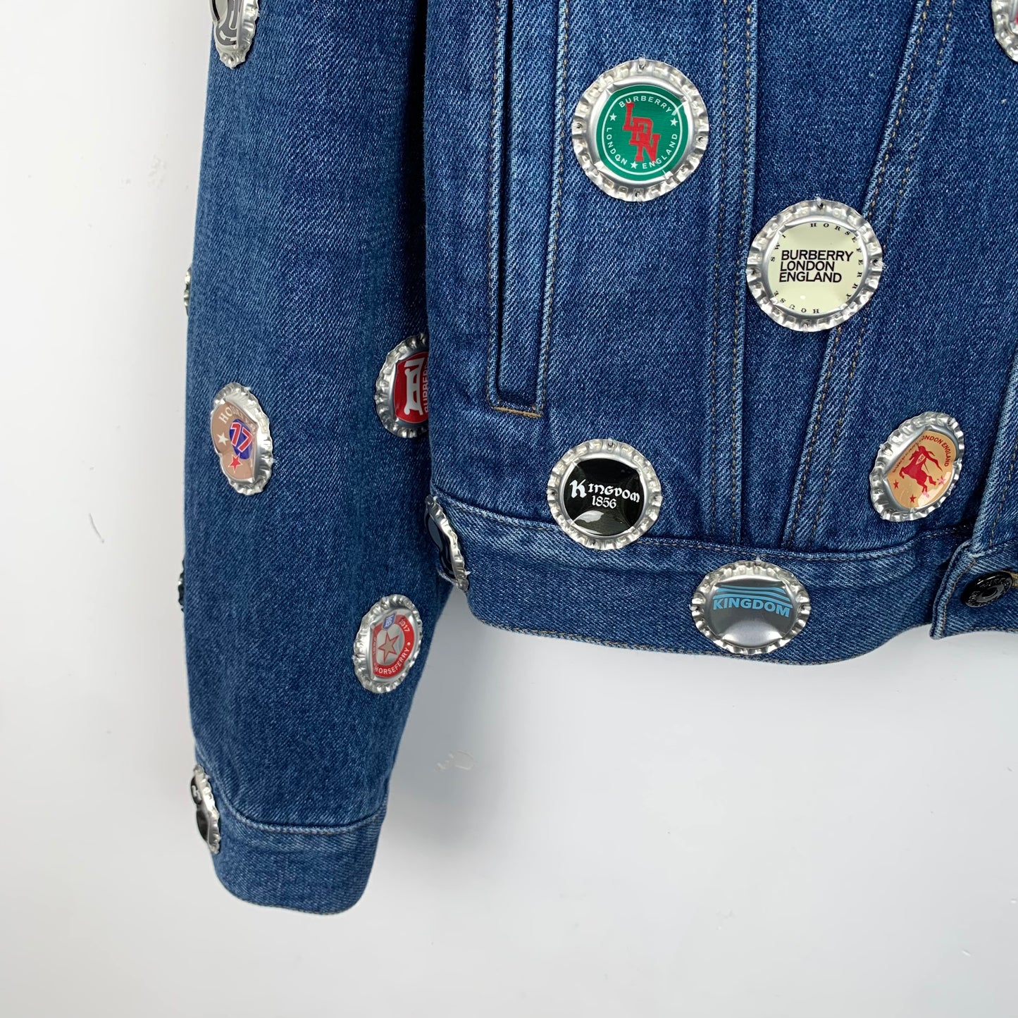 Burberry Blue Denim Jacket with Bottle Cap Embellishments and Collared Design